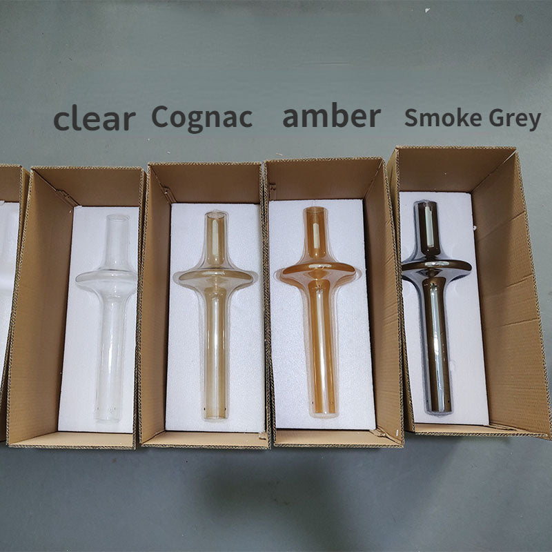 The four glass colors laid in open boxes and labeled clear to smoke gray