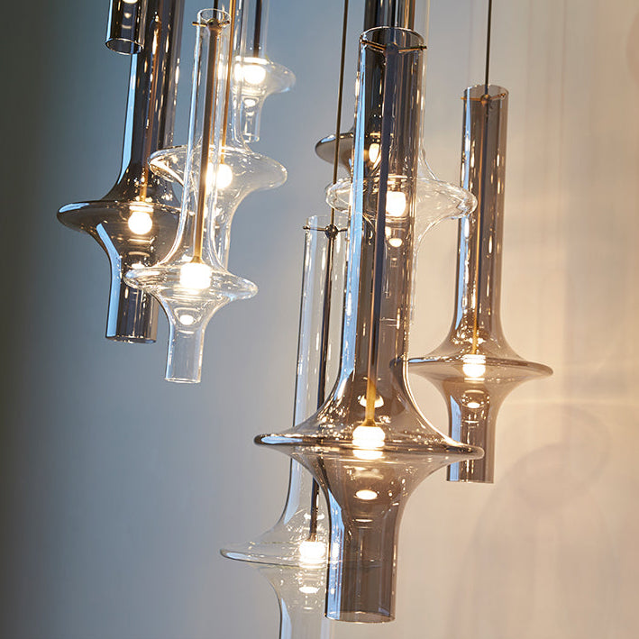 Close view of a group of smoke and amber spindles with filament bulbs