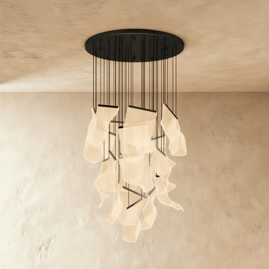 The same long cascade of lit sheets hung from a round black ceiling canopy
