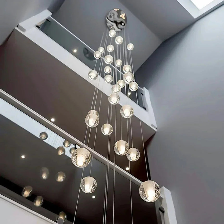 The cluster lit under an angled ceiling above a staircase landing