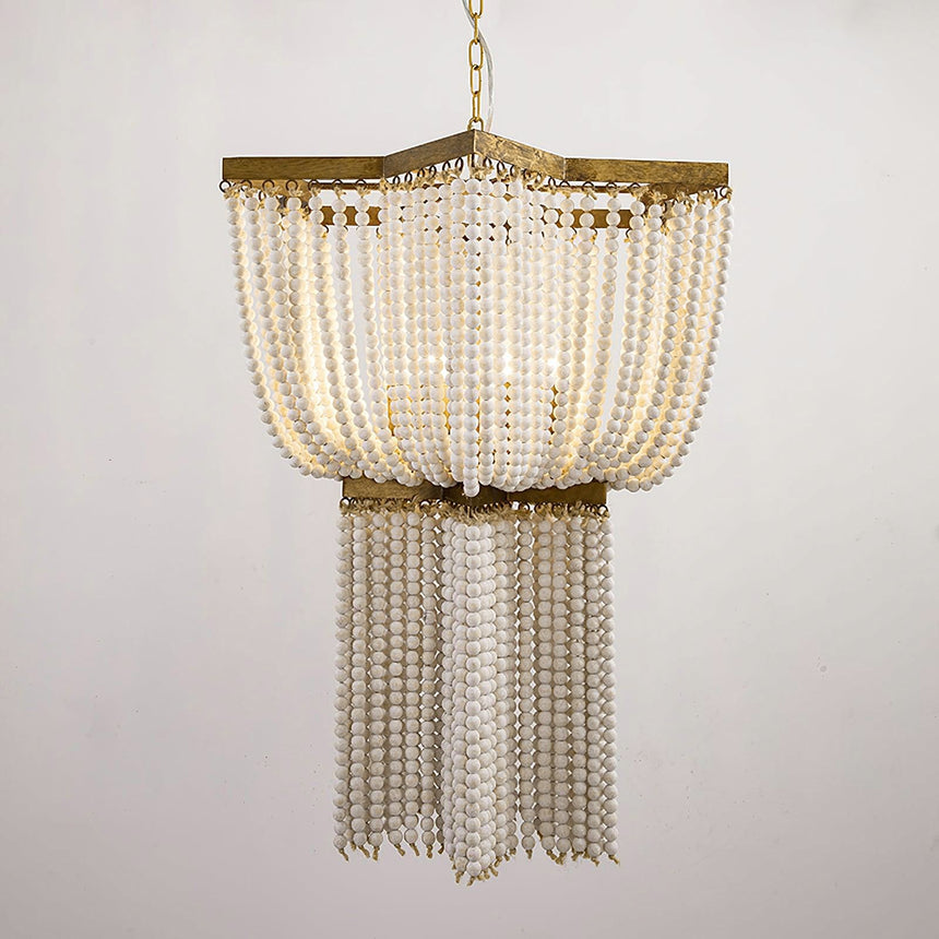 The wide upper tier of bead strands above the narrower lower tier