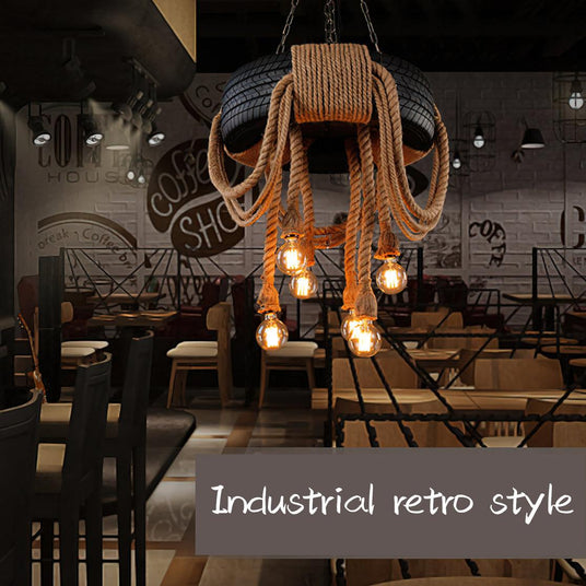 The tire lit above long tables in a room with a bicycle on the wall