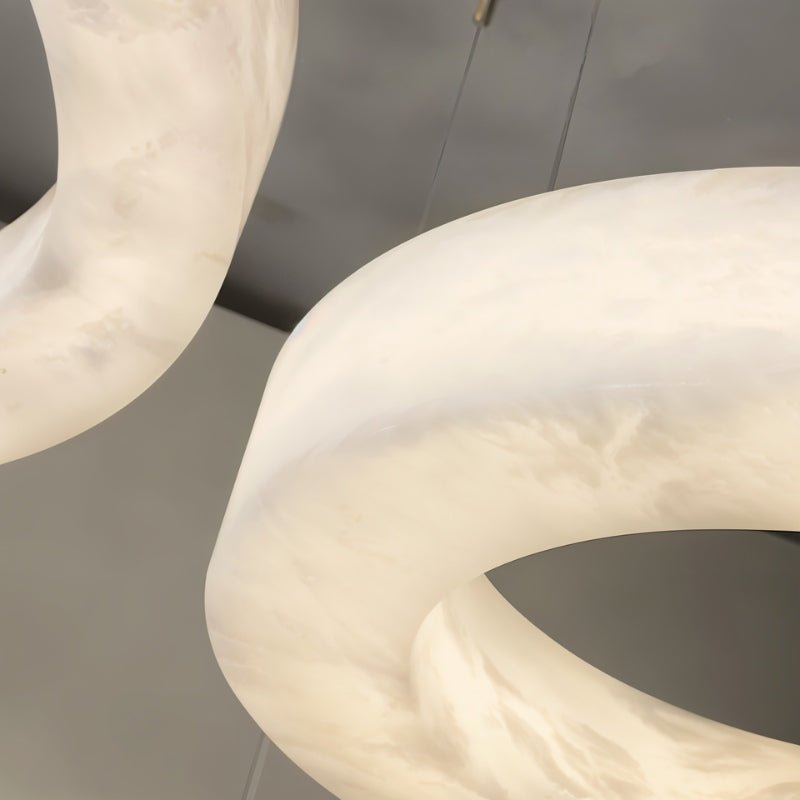The curved surface of the stone ring, veining running through the alabaster