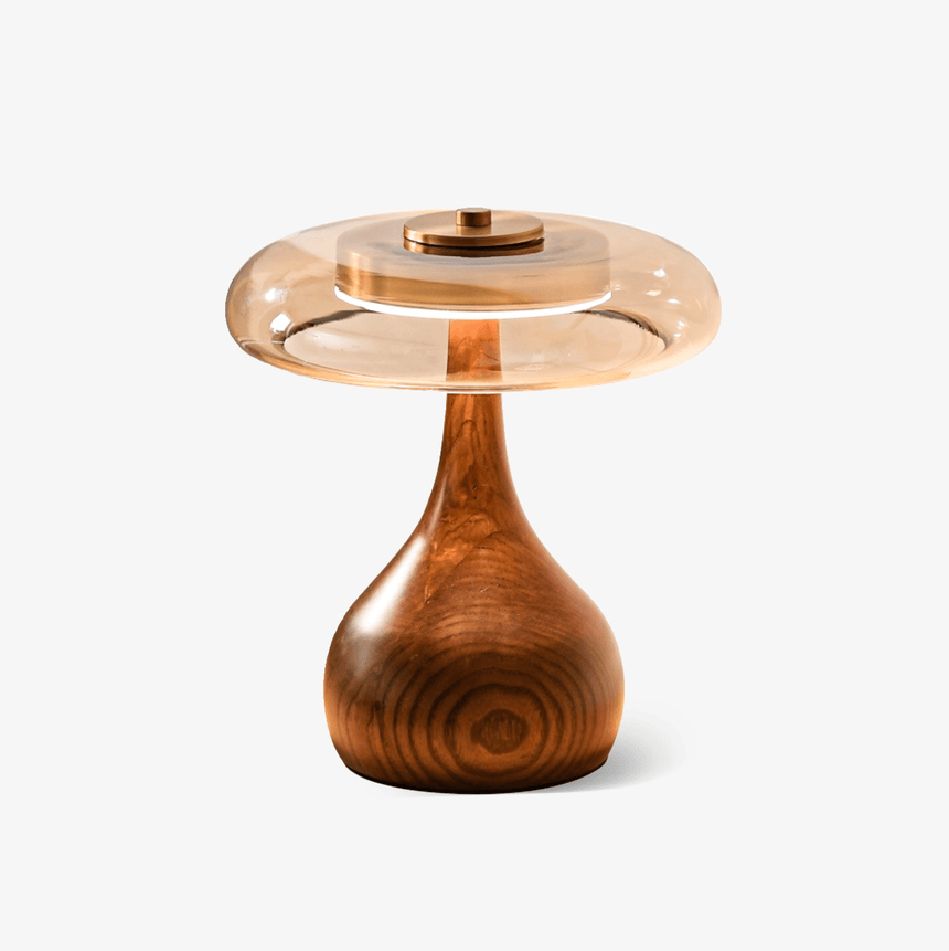 Table lamp with an amber glass shade on a curved walnut base, plain ground