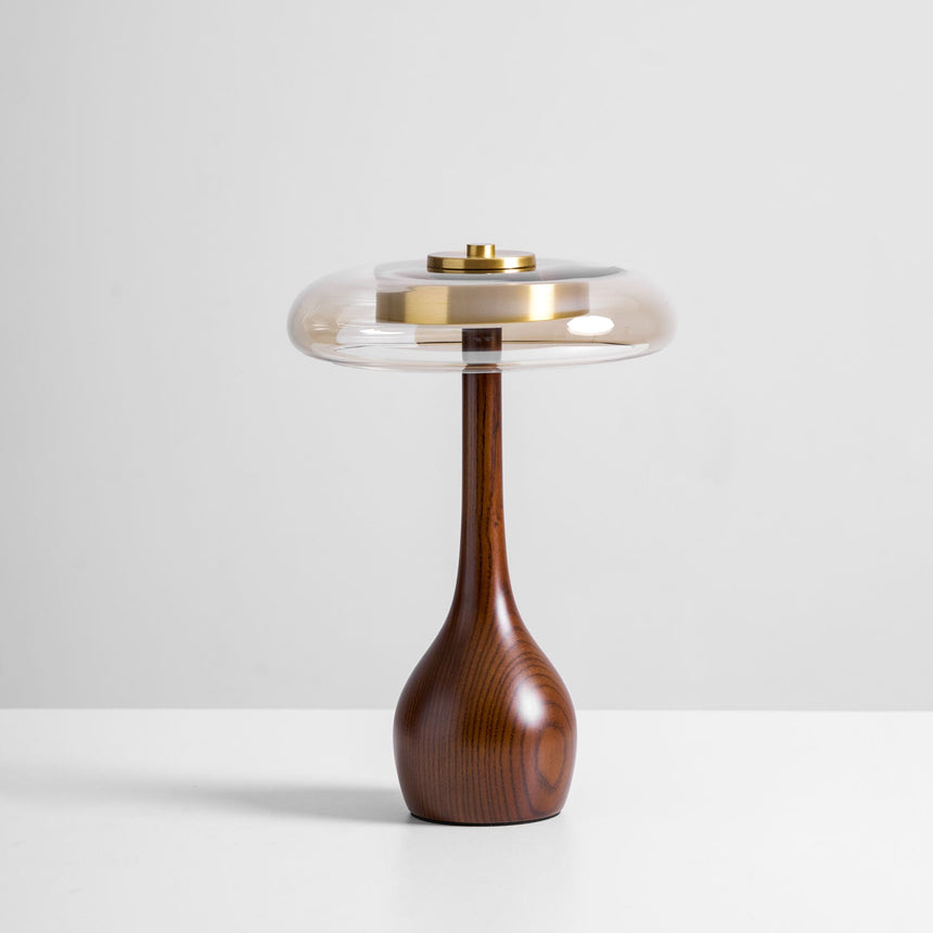 The tall glass shade table lamp seen from the front, plain pale ground