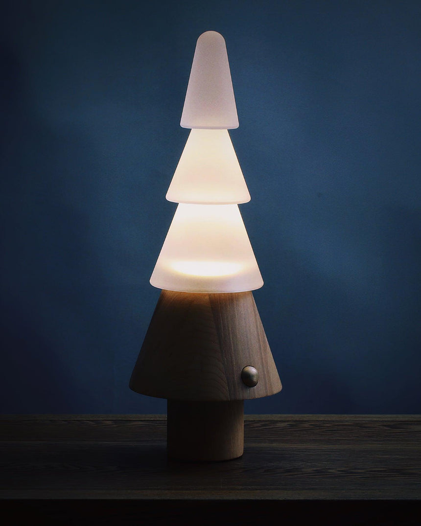 Table lamp with night light lit against a deep blue background