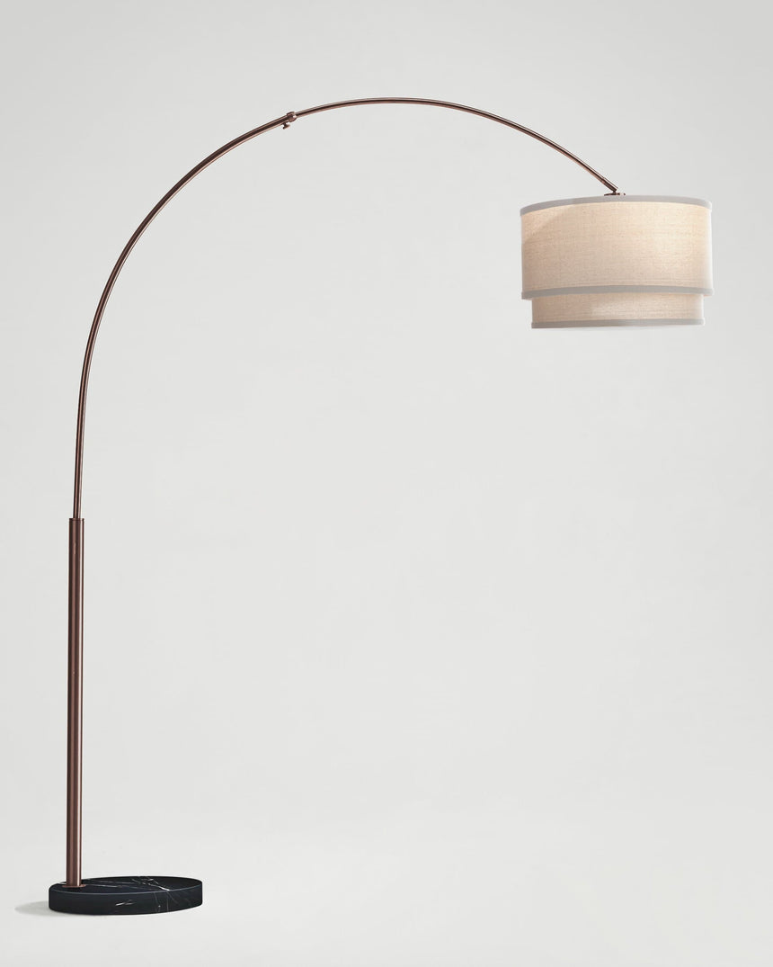 The bronze version of the tall arc with an oatmeal two tier linen shade