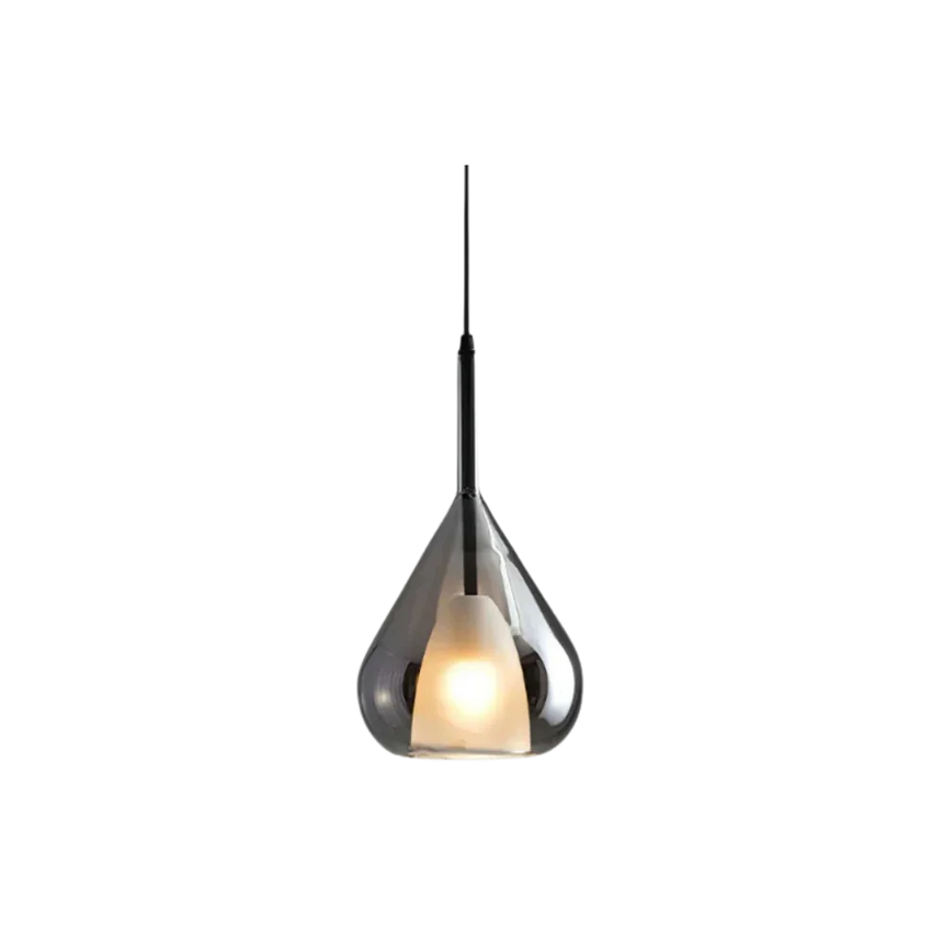 The teardrop shade lit from inside with the glass reading smoked at the top