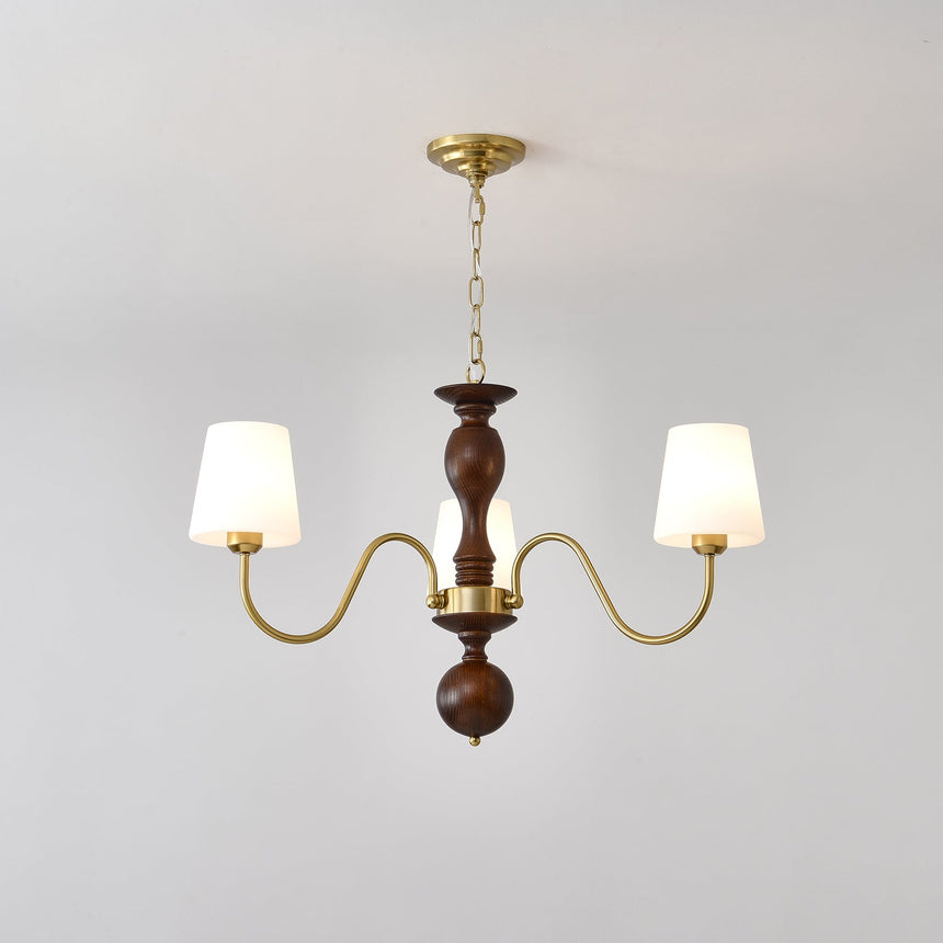 Three light chandelier with white fabric cones on a walnut column