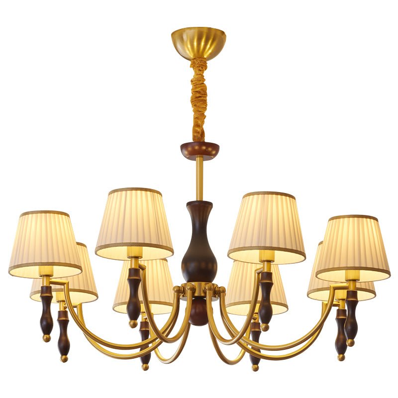 The eight light build lit warm with pleated shades all round