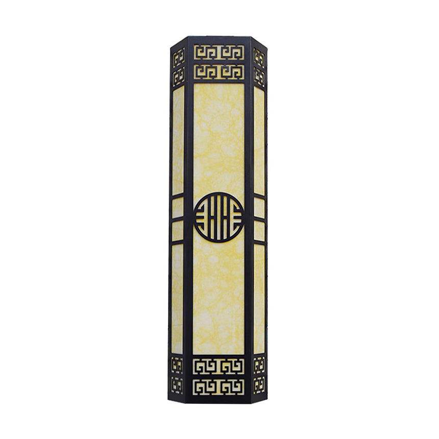 Front view of the unlit column, the round medallion centered between two bars