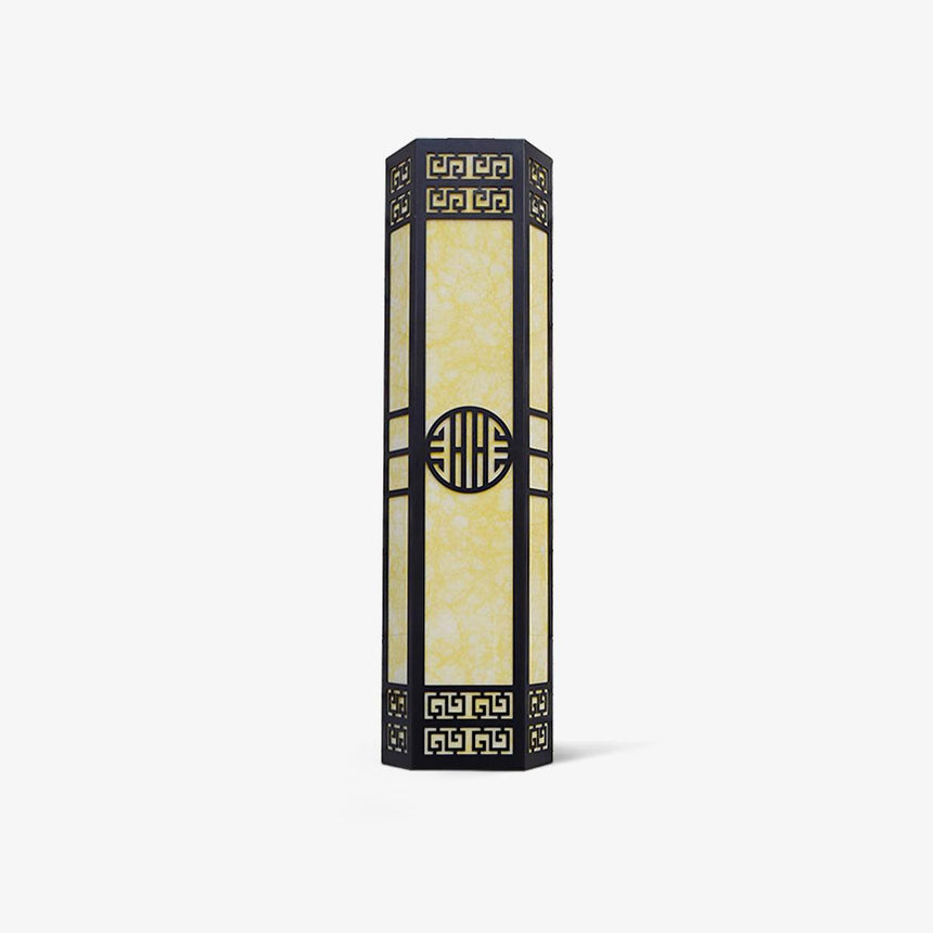 Three quarter view of the column, its angled faces and the fretwork at each end