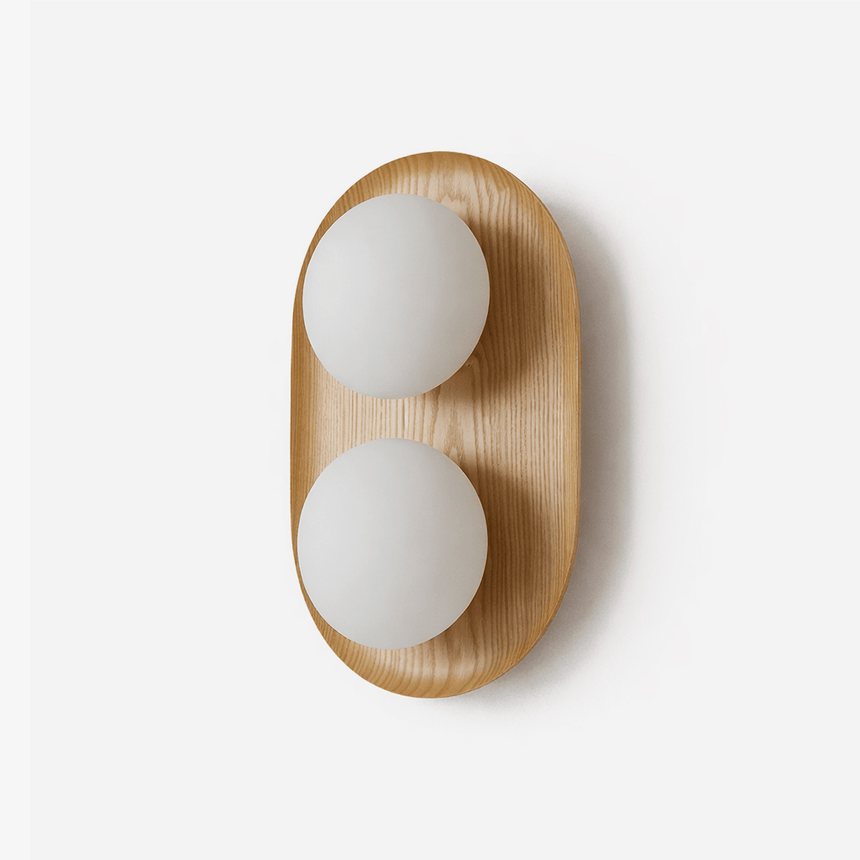 Two light wall sconce, a wood capsule holding two opal glass globes