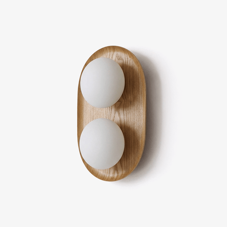 The smaller wood capsule with two opal globes stacked one over the other