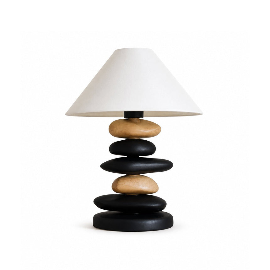 Unique table lamp with a light wood and matte black mixed stack