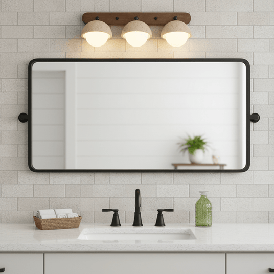Three domes lit above a rectangular mirror on a tiled bathroom wall