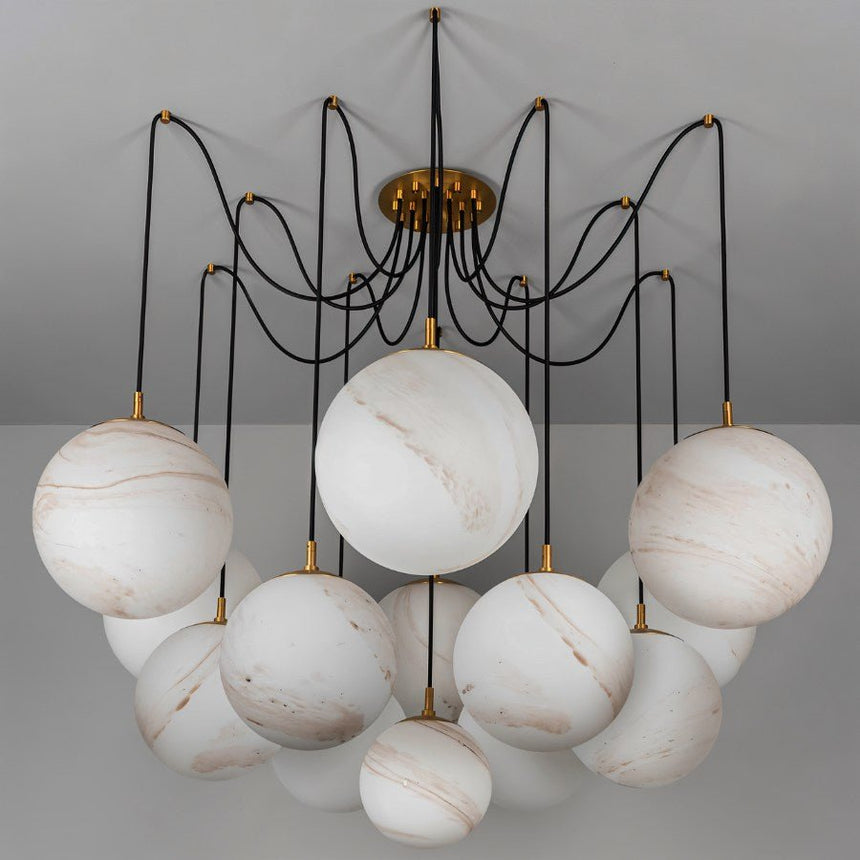 The globes unlit on black arms, veining visible in each alabaster sphere