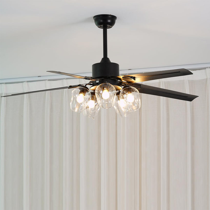 Black ceiling fan seen from below with the globe lights on