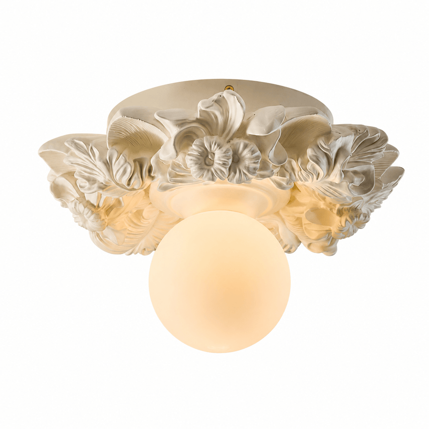 Carved floral ceiling light in white finish seen at an angle