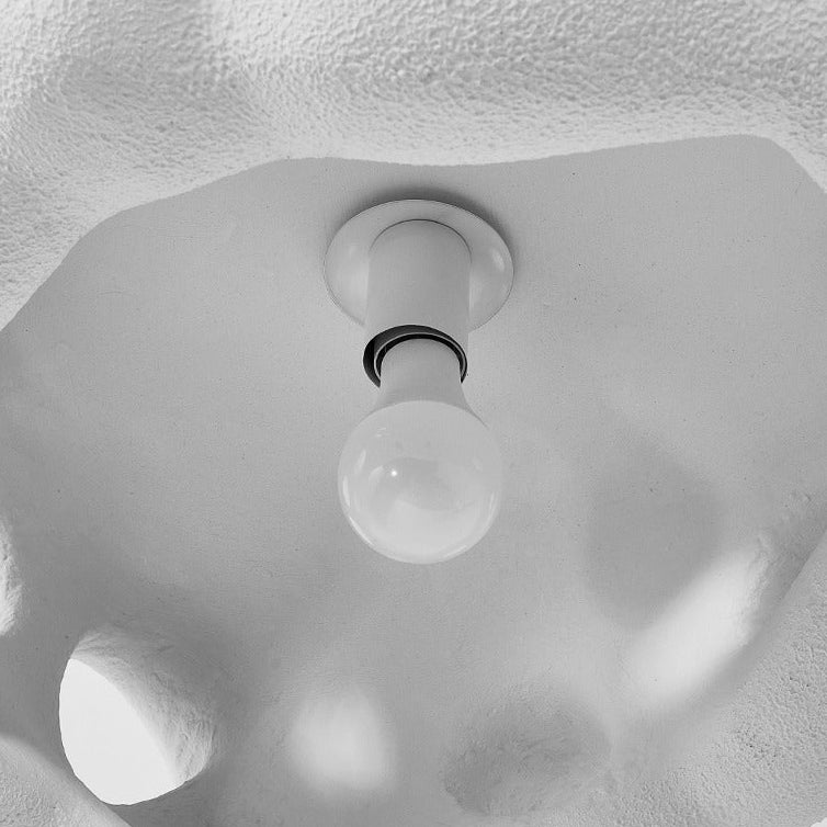 Underside of the shade showing the bulb through the openings