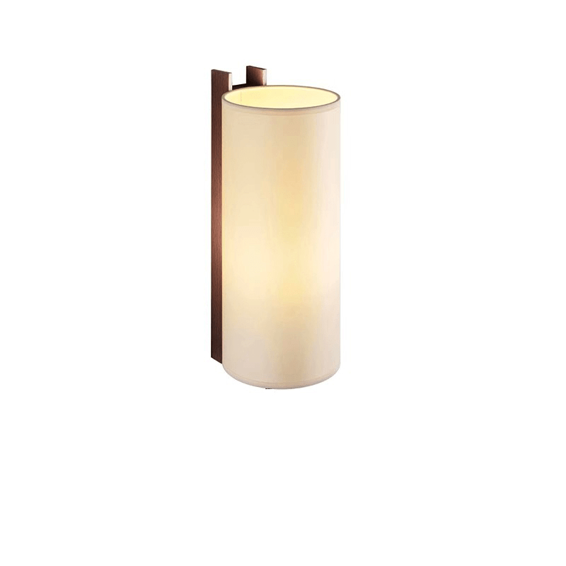 The tall beige shade wrapped around the wood post, seen unlit and lit