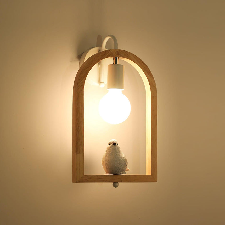 The bird lit against a warm ochre wall, the globe bright above it