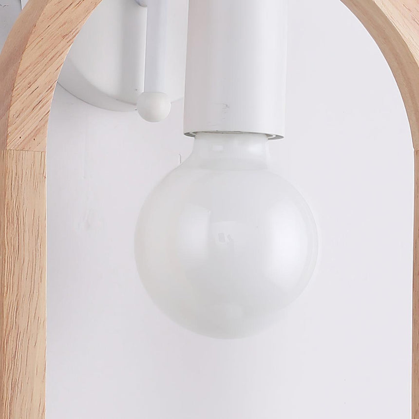 Close view of the clear globe lamp hanging from the white socket