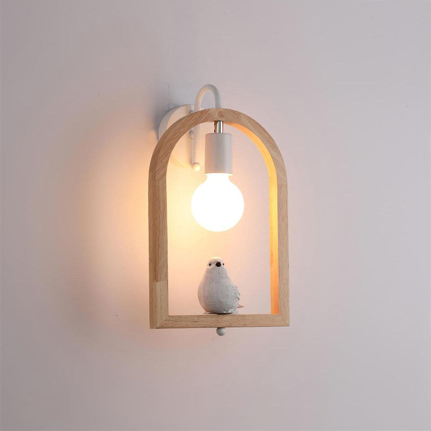 The bird model lit on a pale wall, the globe glowing inside the arch