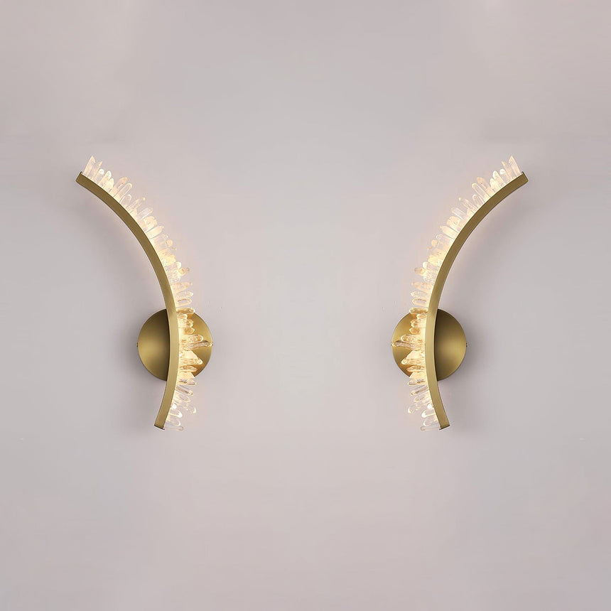 The left and right arms shown apart on a pale wall, each on its own round plate