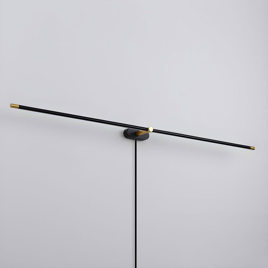 The black rod seen unlit, a thin bar crossing a small central hub