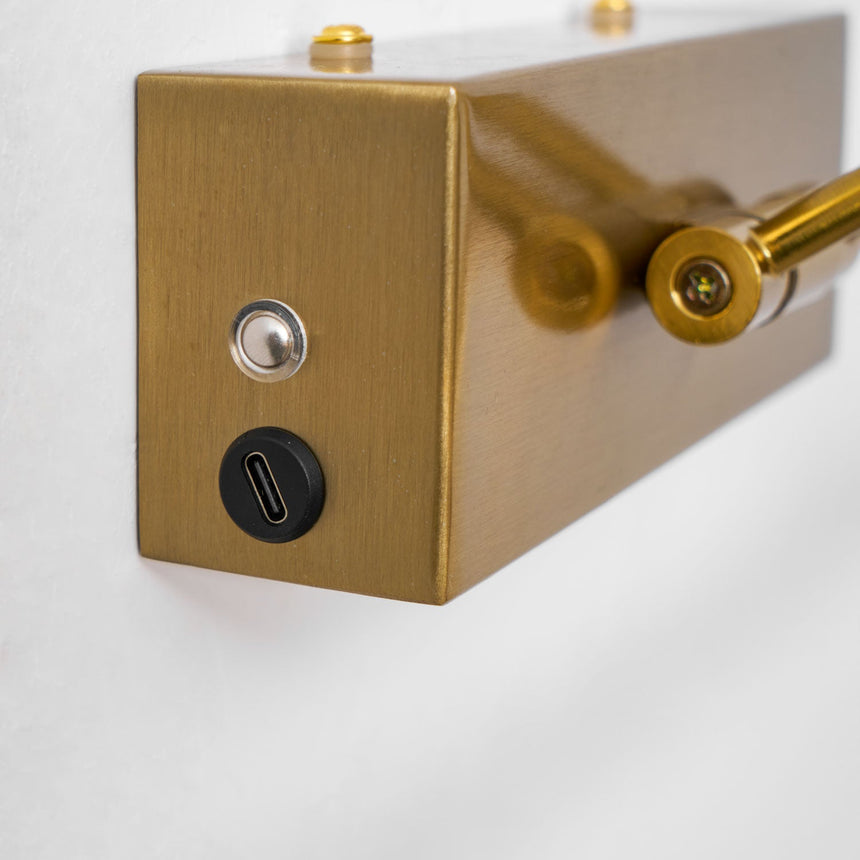Close view of the wall box with its charging port and the small rocker switch