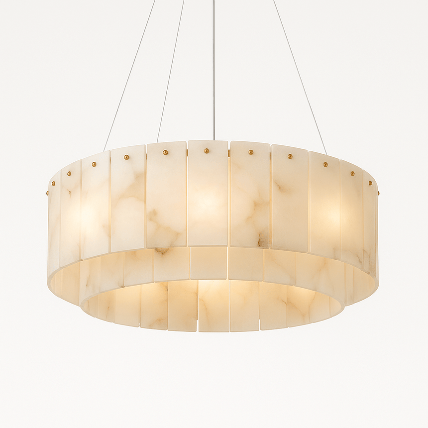 A drum of white alabaster panels lit, hung on four thin cables