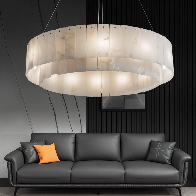 The lit drum in a living room with a gray sofa and a slatted wall