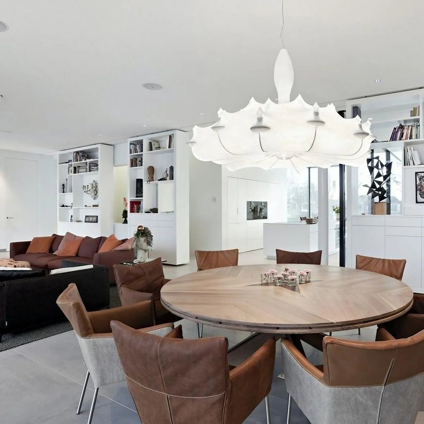 Layered silk shade hung over a round table in a bright room
