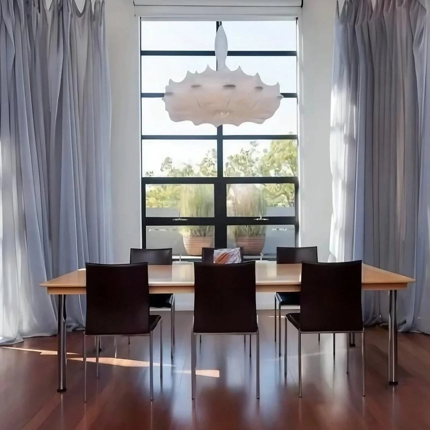 Layered silk pendant hung in front of tall windows
