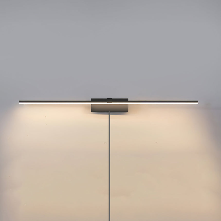 The dark version lit on a gray wall, a flat bar washing light down the plaster