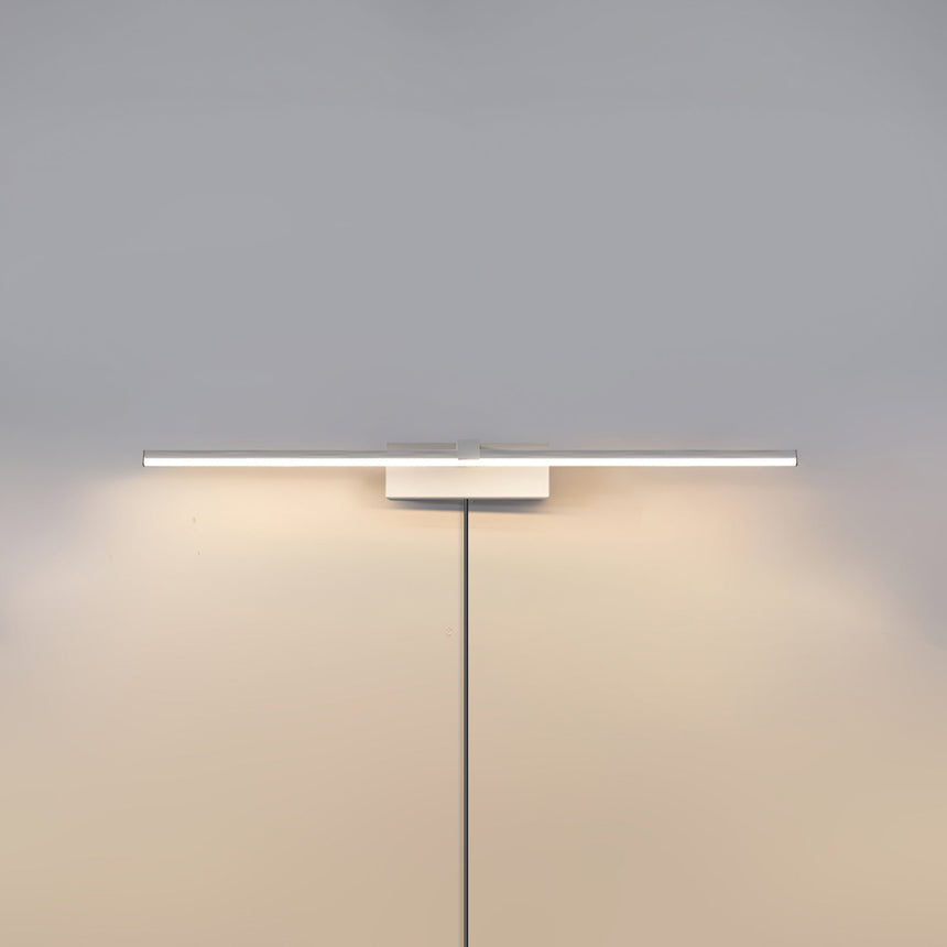 The white version lit on a pale wall, the cord hanging below the offset block