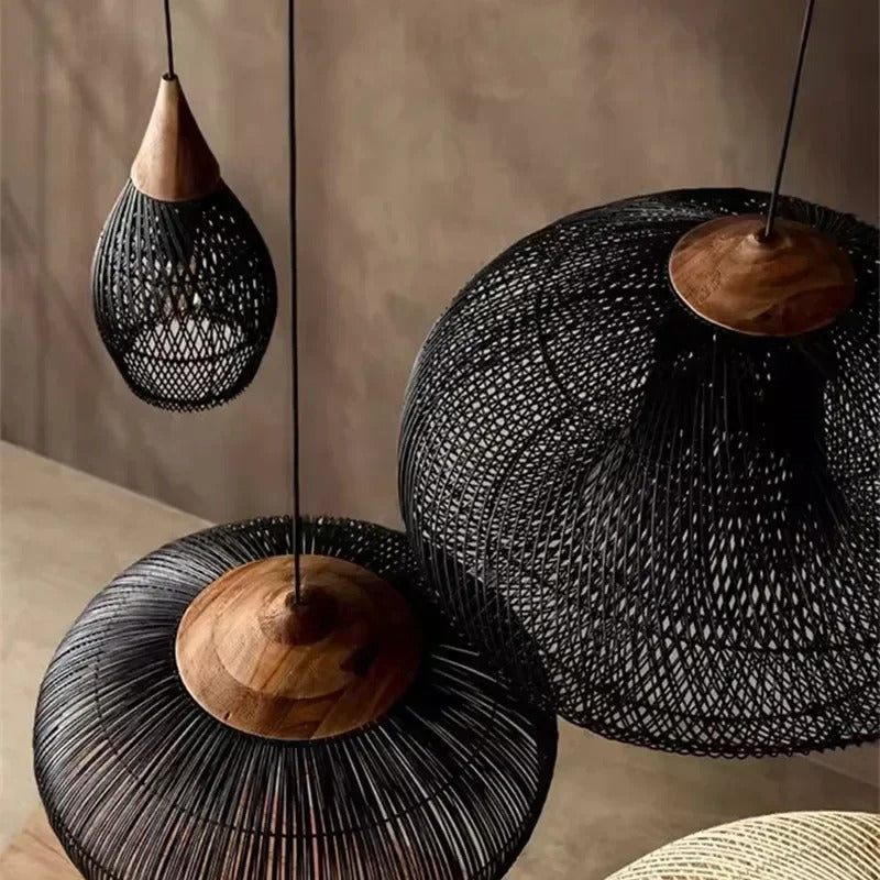 Two black wicker domes hung side by side in a pale room