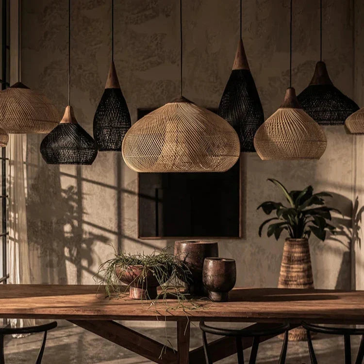 Wicker shades lit in a restaurant with wooden tables