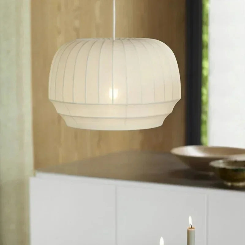 Knitted cloth shade above a white kitchen counter
