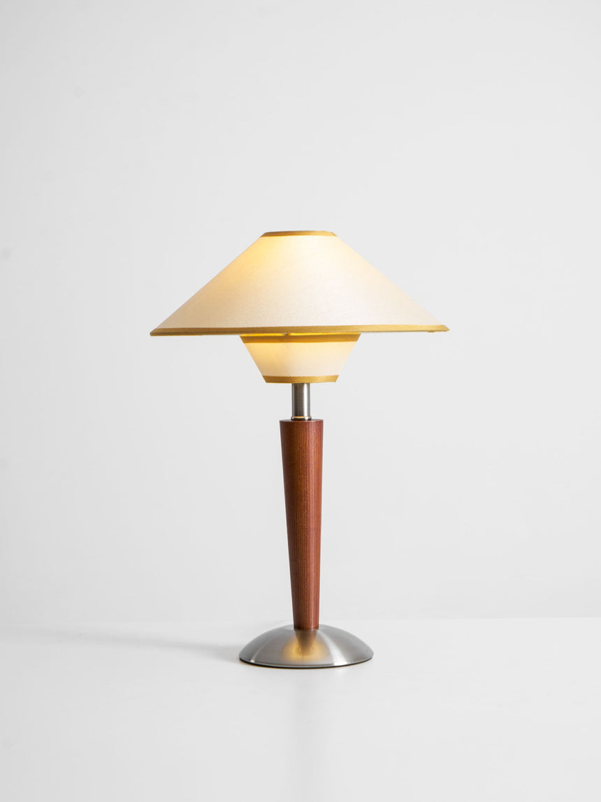 Wood table lamp with the beige two tier shade on a plain background
