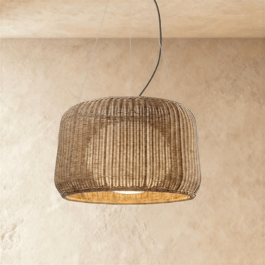 A woven wicker drum shade with a pinched waist, open at the base