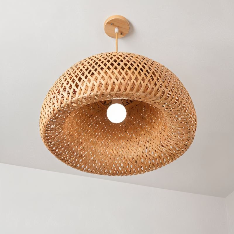 The open base of the shade seen from below with the lamp at its center