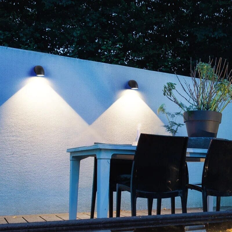 Aluminum LED wall lamp weatherproof mounted on a modern garden entryway wall with soft up and down illumination