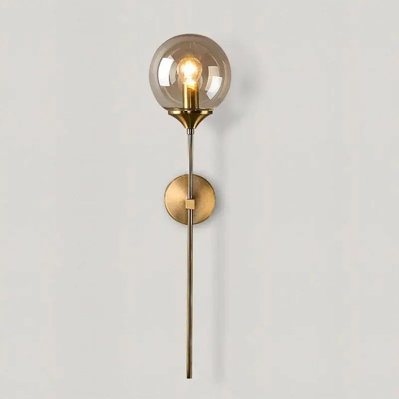 Glass orb LED wall lamp with iron frame mounted in a modern bedroom with neutral decor