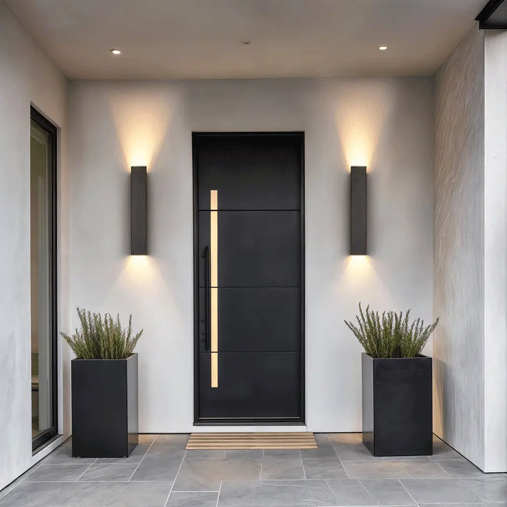 Slim aluminum IP65 outdoor LED wall lamp mounted on a modern home exterior entryway wall