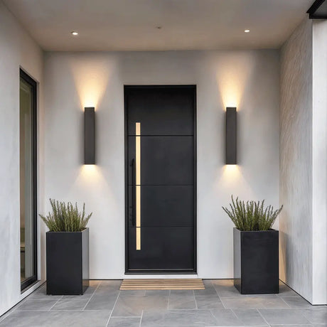 Slim aluminum IP65 outdoor LED wall lamp mounted on a modern home exterior entryway wall