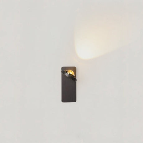 Rotatable acrylic wall lamp with soft LED glow mounted in a modern kids bedroom with neutral decor