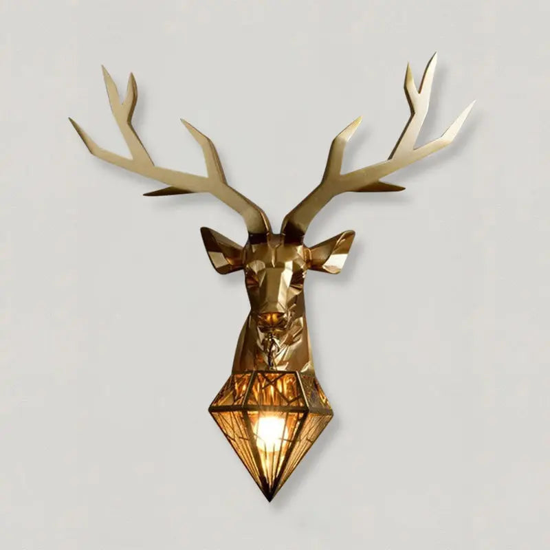 Resin LED antler wall lamp in gold finish mounted on a neutral wall in a rustic hallway