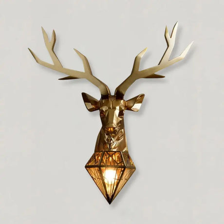 Resin LED antler wall lamp in gold finish mounted on a neutral wall in a rustic hallway